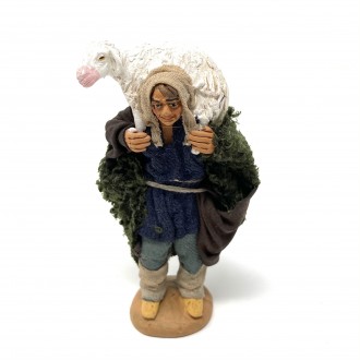 Shepherd with sheep on his shoulders