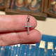 White gold cross and zircons