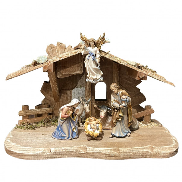 hut with nativity complete with angel glory, donkey and ox in wood
