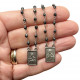 Scapular coined silver and hematite plates