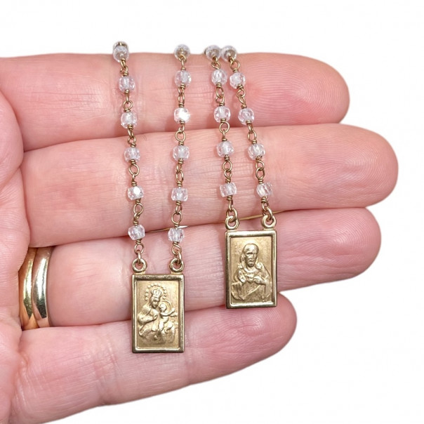 Scapular coined plates in rose silver and white zircons