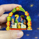 Peruvian nativity scene with small flower garland