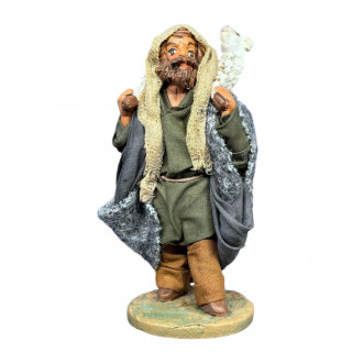 Vecchio con pecora in spalla