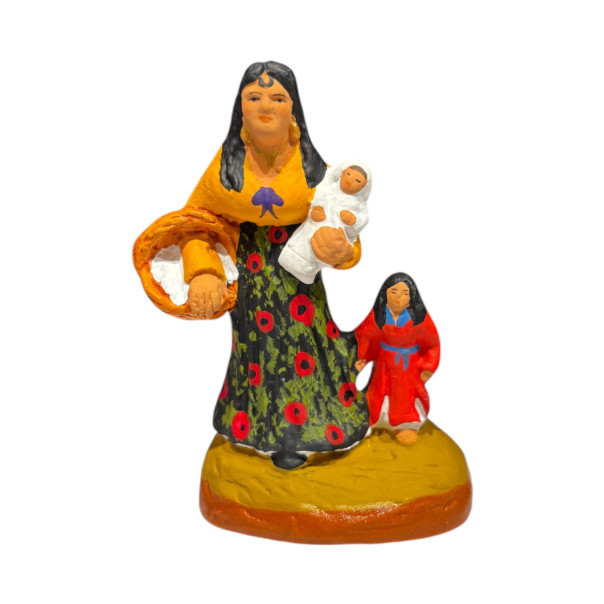 Little woman sitting on Santons...