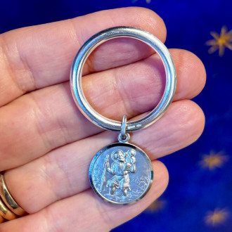 Silver keychain with Saint...